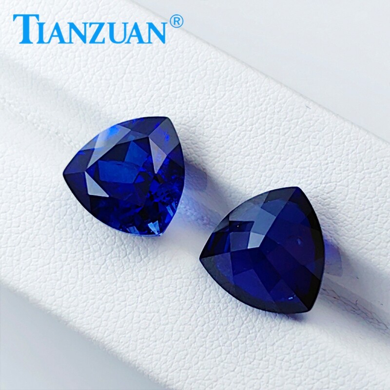 Lab Created Trillion shape Royal Blue Sapphire loose gemstone with Inclusions