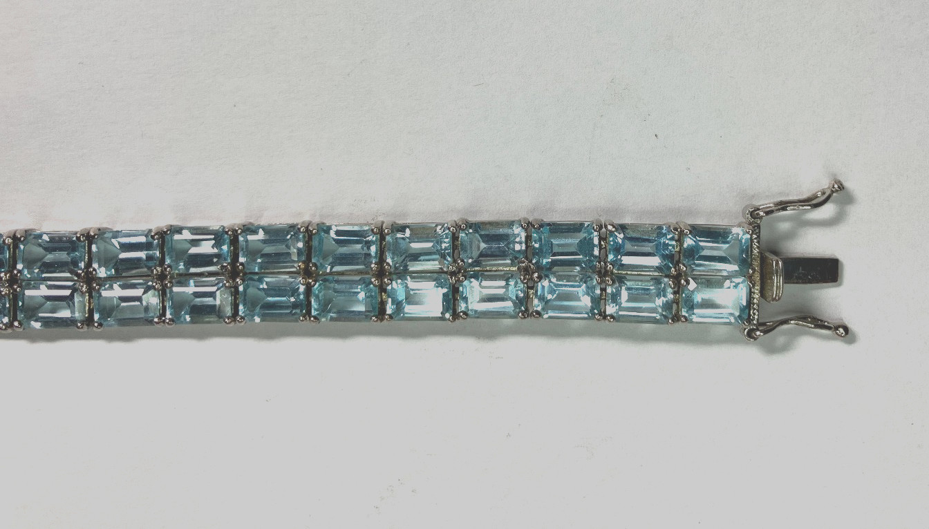 8” TENNIS BRACELET -ADI 925 STERLING SILVER – 40 EMERALD CUT TOPAZ STONES -NICE!
