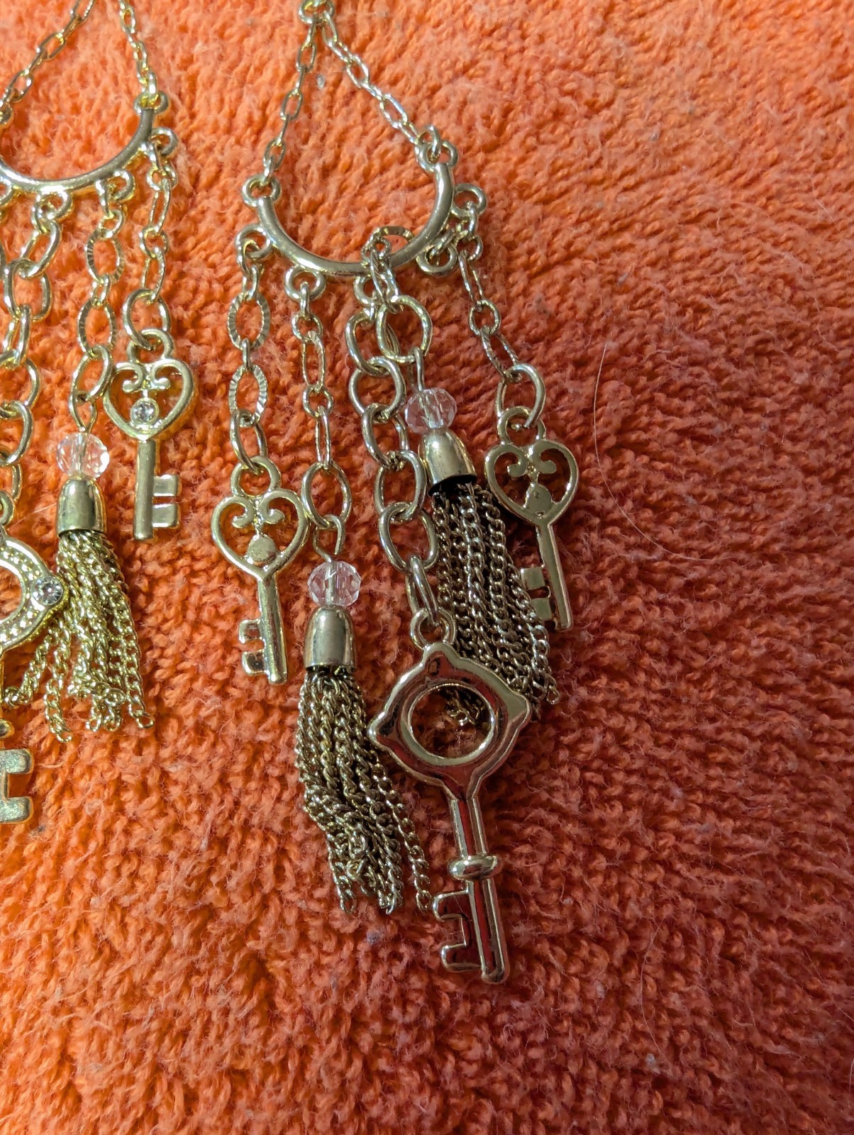 Earrings With Dangling Chains And Various Pendants