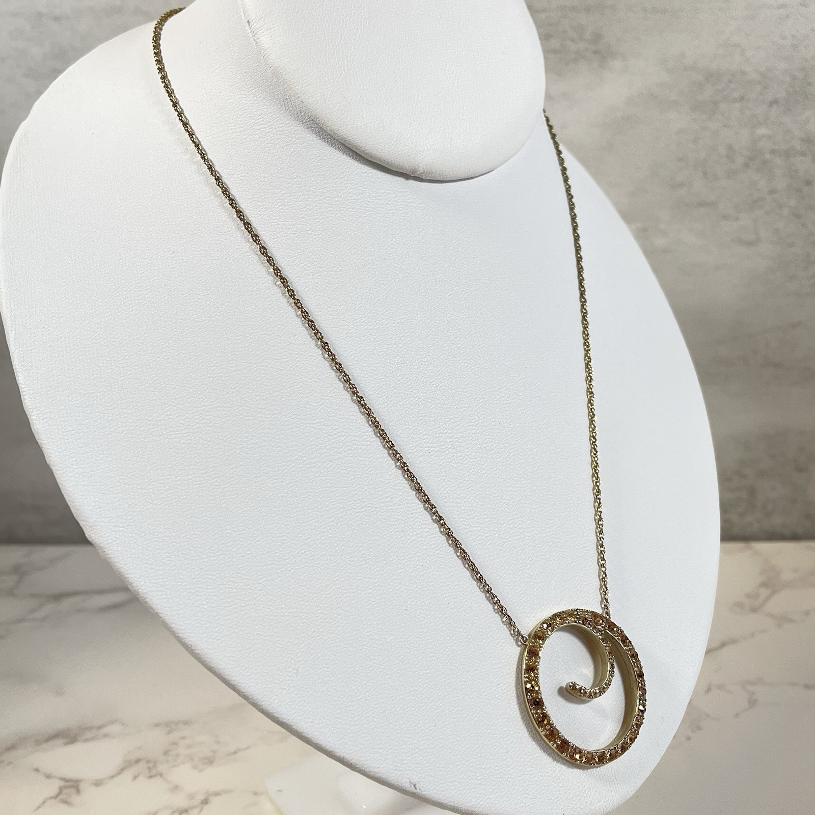 Vintage Monet Gold Tone Topaz Rhinestone Swirl Circle Pendant Necklace Chain 16″