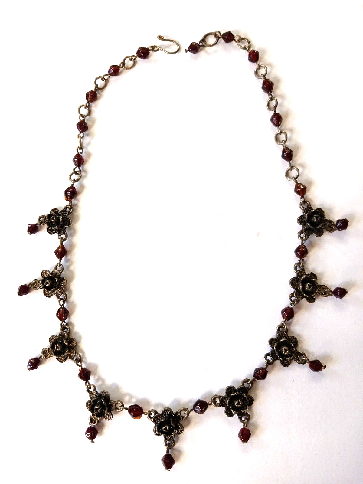Beautiful silver tone necklace with flowers and red stones. hook clasp. Vintage