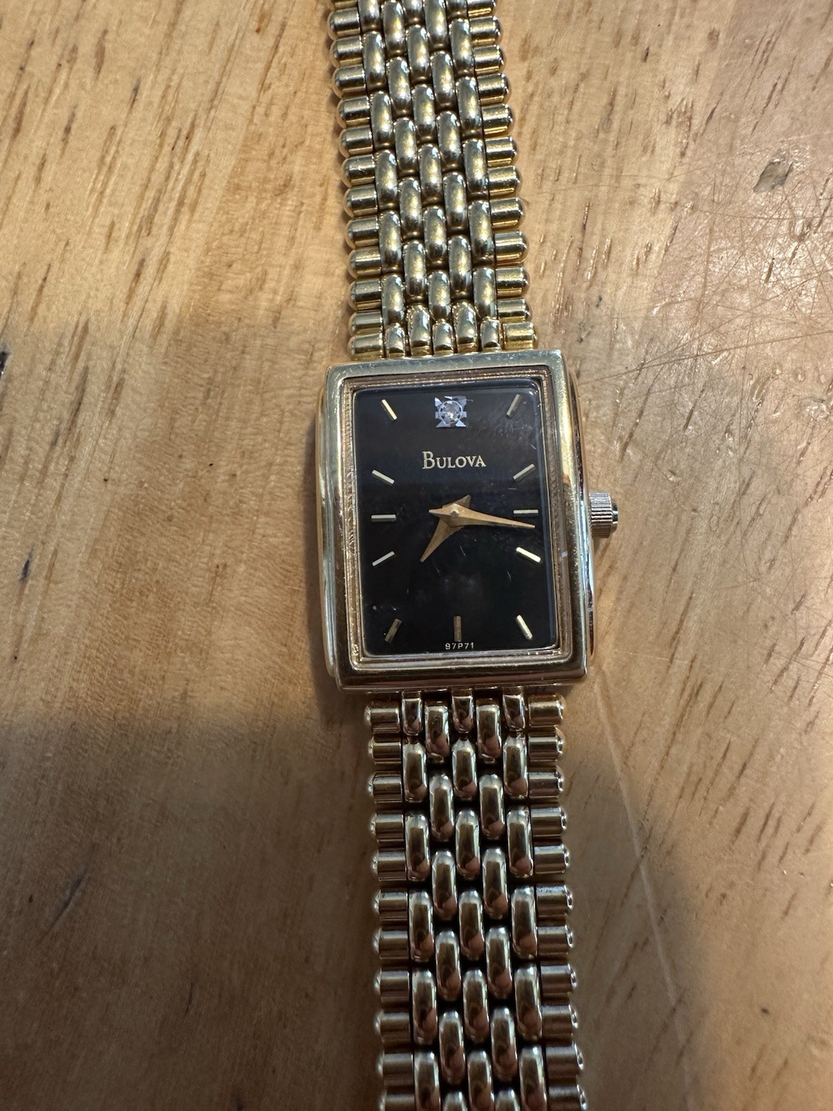 Bulova Quartz T4 Base Metal Bezel Stainless Steel Back Gold Tone With Black Dial