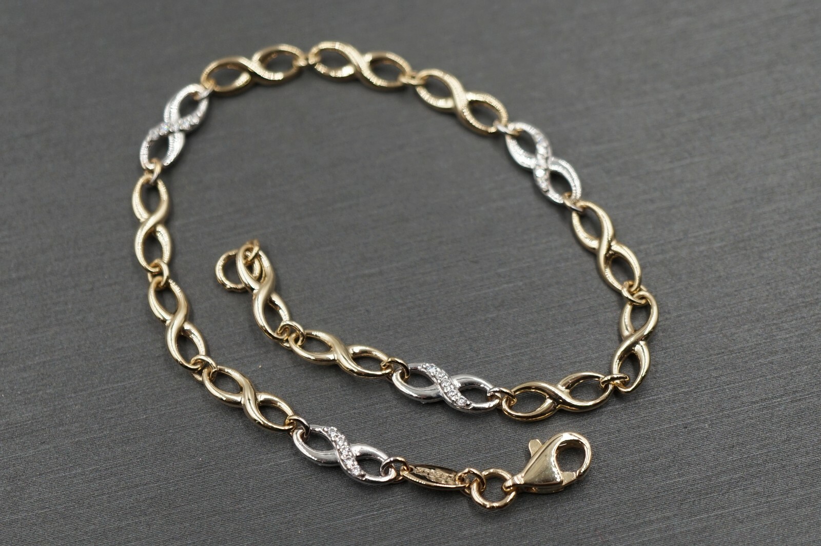 14K Yellow Gold Fancy Hollow 3.8MM Two Tone Infinity CZ Bracelet. 7 inches
