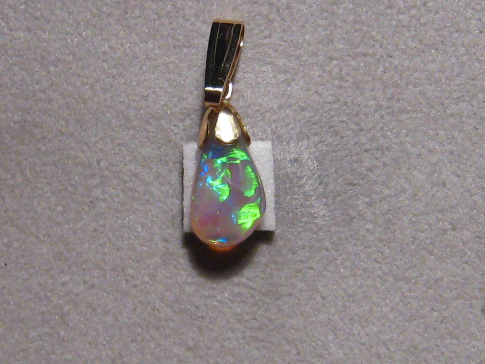 .90 ct. small Bright Opal Pendant , Solid 14 k yellow gold
