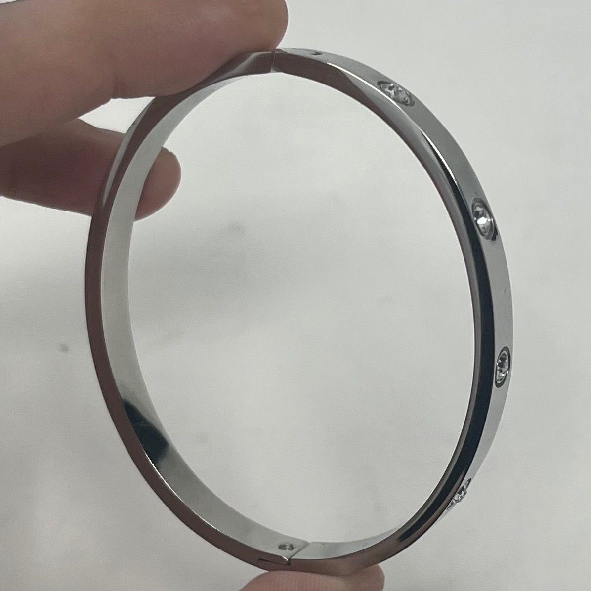 PAVOI Silver Tone Cubic Zirconia Hinged Bangle Bracelet Screw Motif