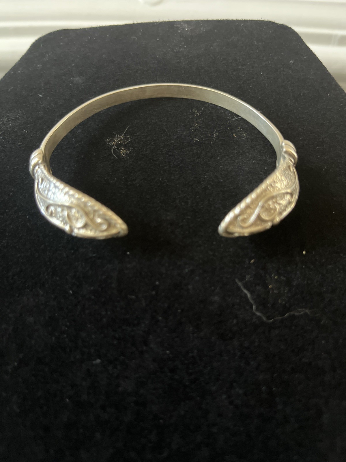 Artisan Sterling Silver Cuff Bracelet With Decorative Finial at Each Open End.