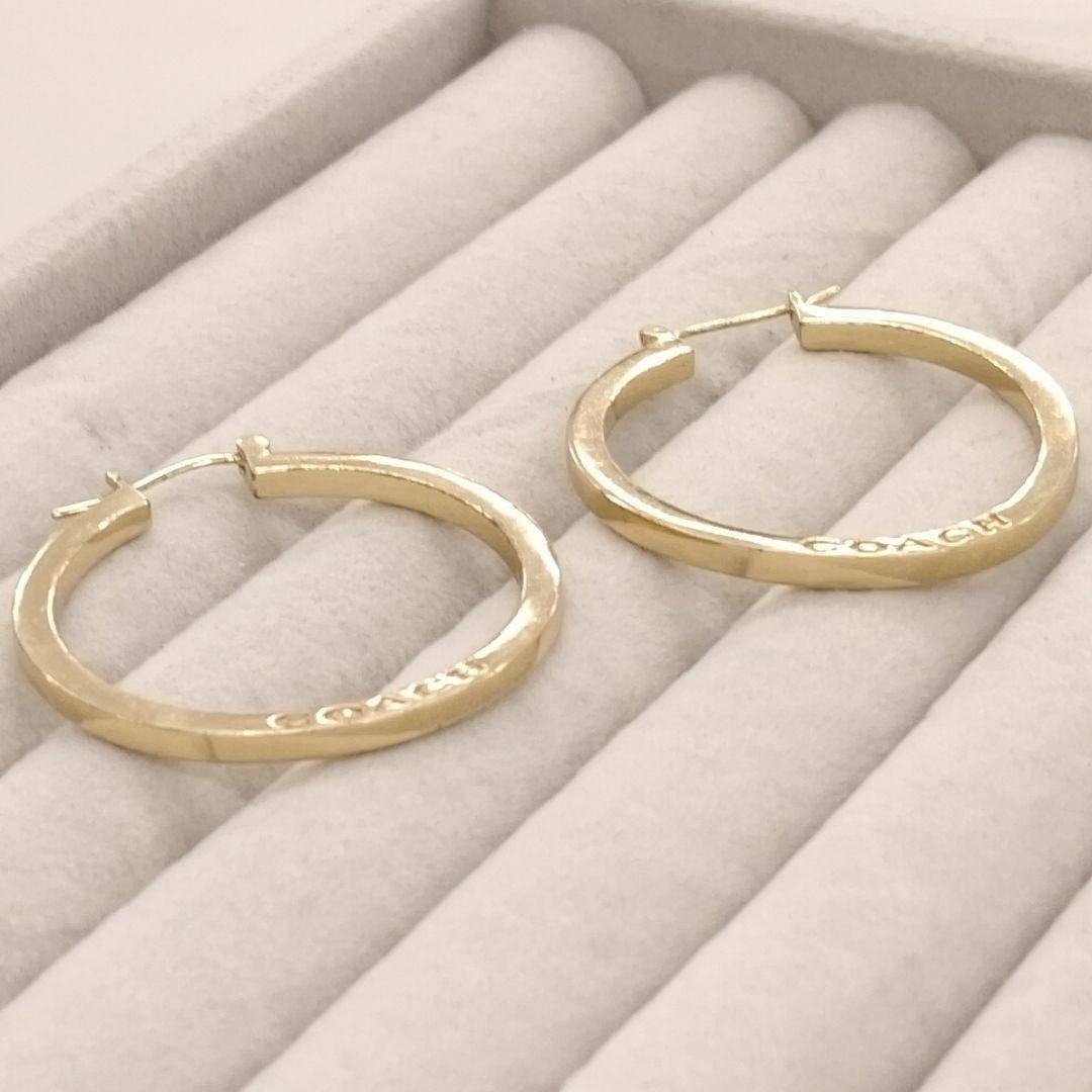 Near mint COACH logo x gold large hoop earrings