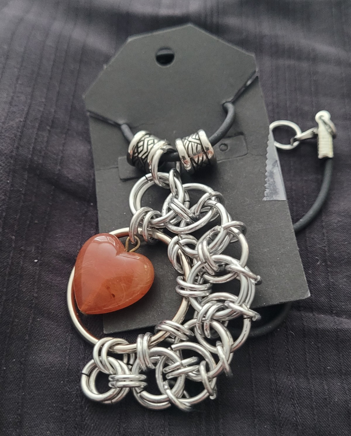 Heart Shaped orange Carnelian Stone In A Chainmail Pendant With Pewter Beads