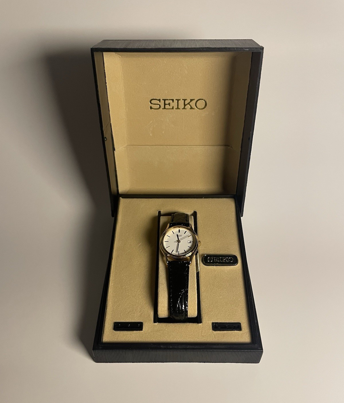 Seiko Quartz Dress Watch SXD370 Gold Tone White Dial Date Black Leather