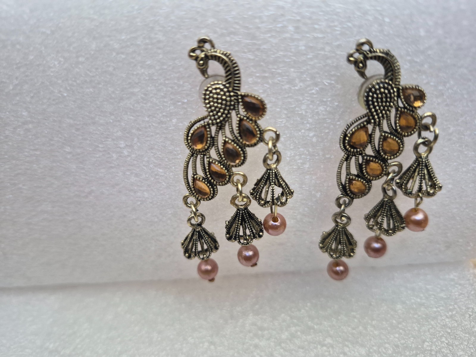 Peacock design Jhumka earrings for women with pearls and stone