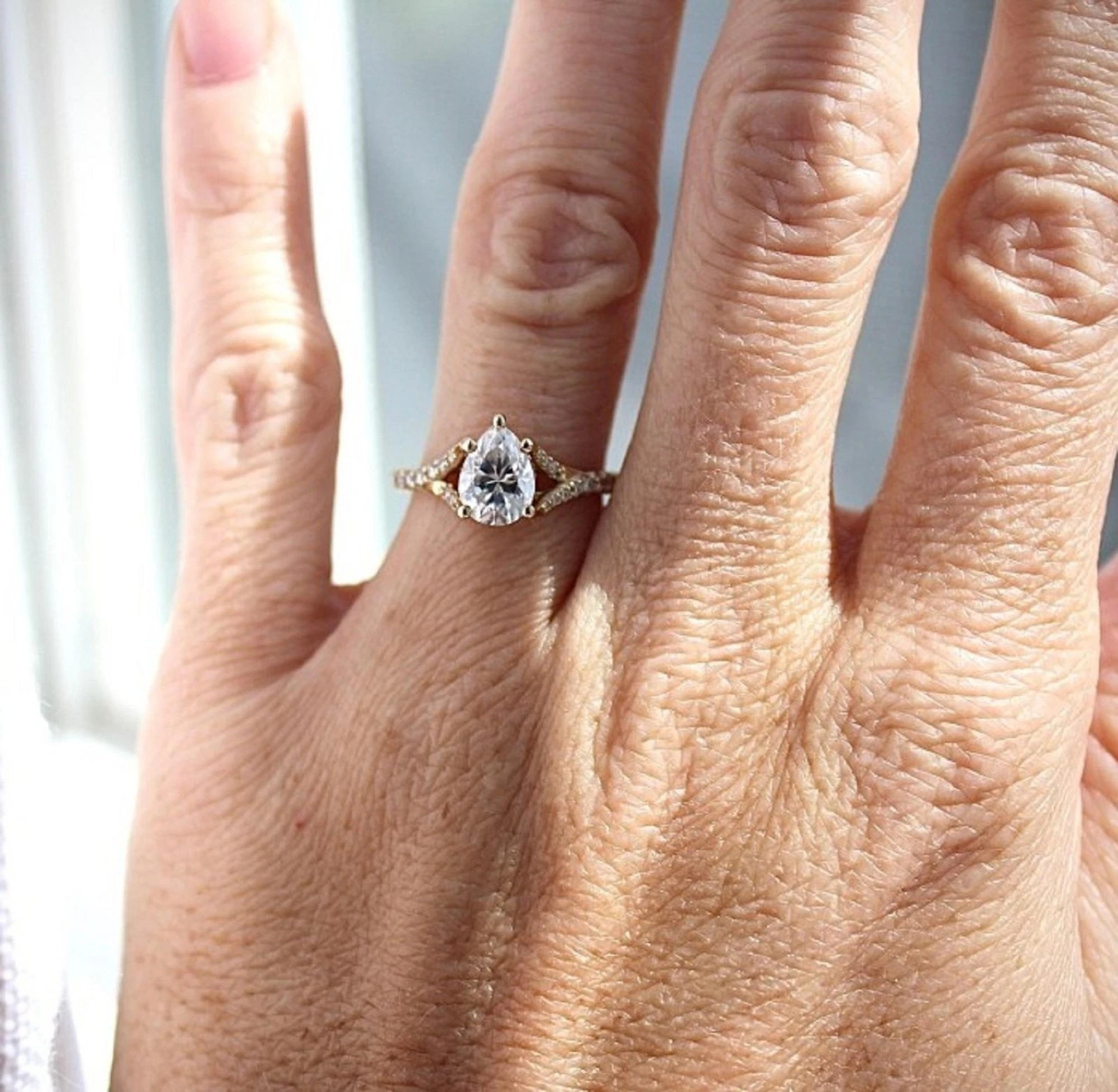 Sparkling 1.25CT Pear Cut White Moissanite With 10K Yellow Gold Ring For WomenFN