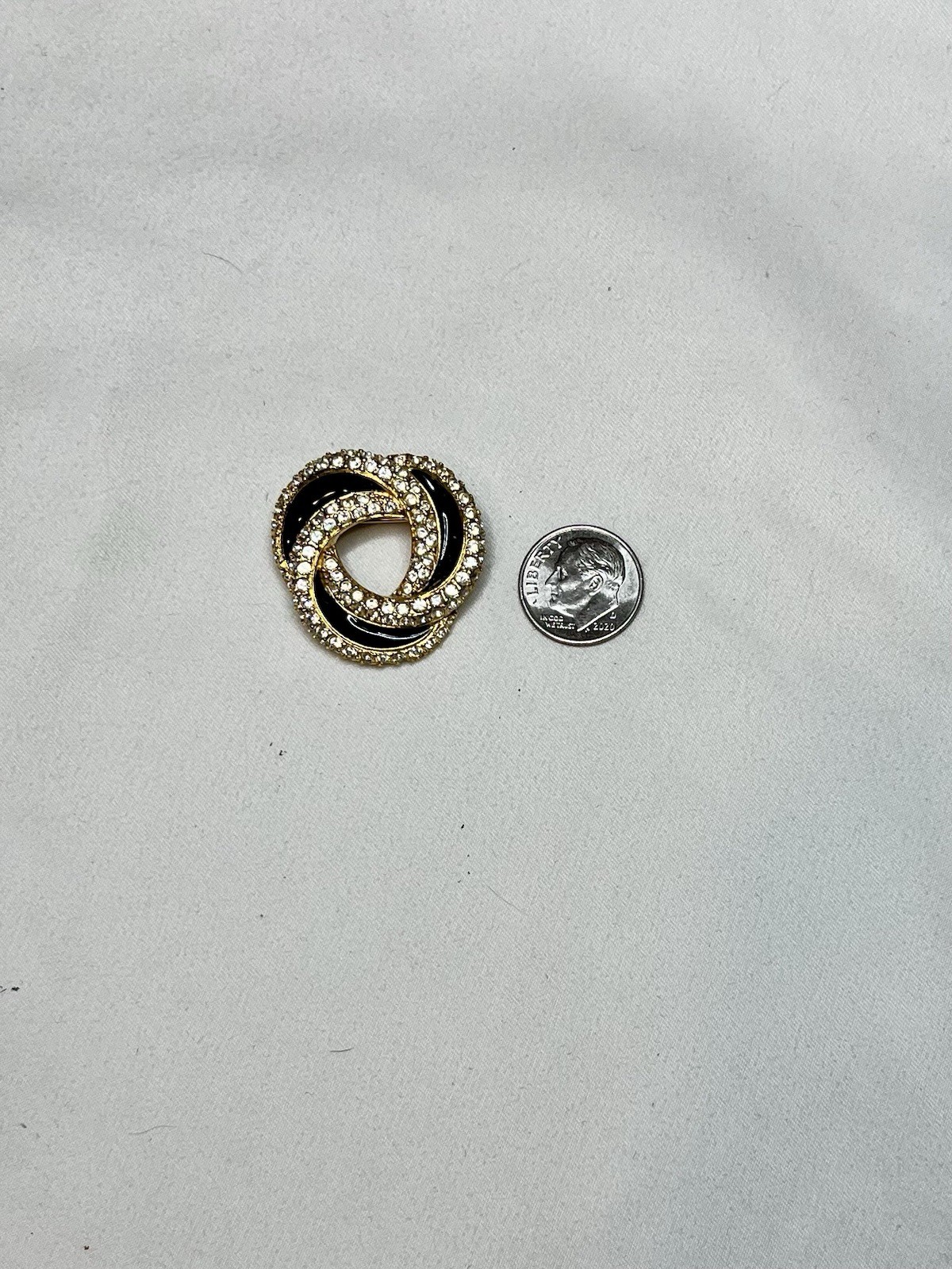 Signed Swarovski Gold Tone Clear Crystal Black Enamel Love Knot Brooch Pin