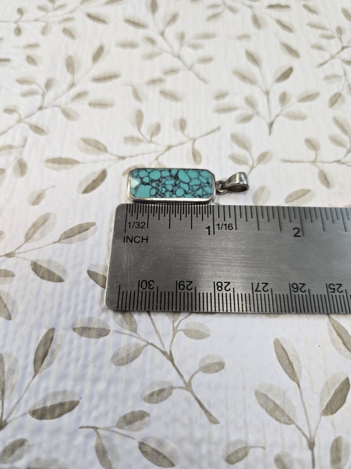 Sterling silver (925) turquoise pendant featuring a rectangular cabochon