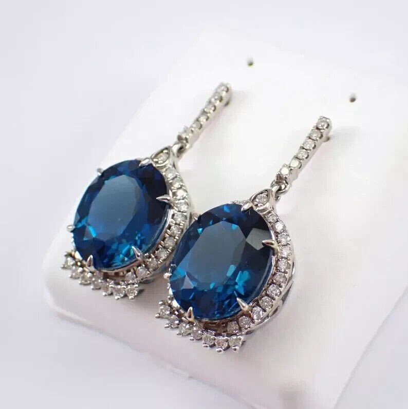 Oval Cut Simulated London Blue Topaz Halo Drop Earrings In 14k White Gold Plated