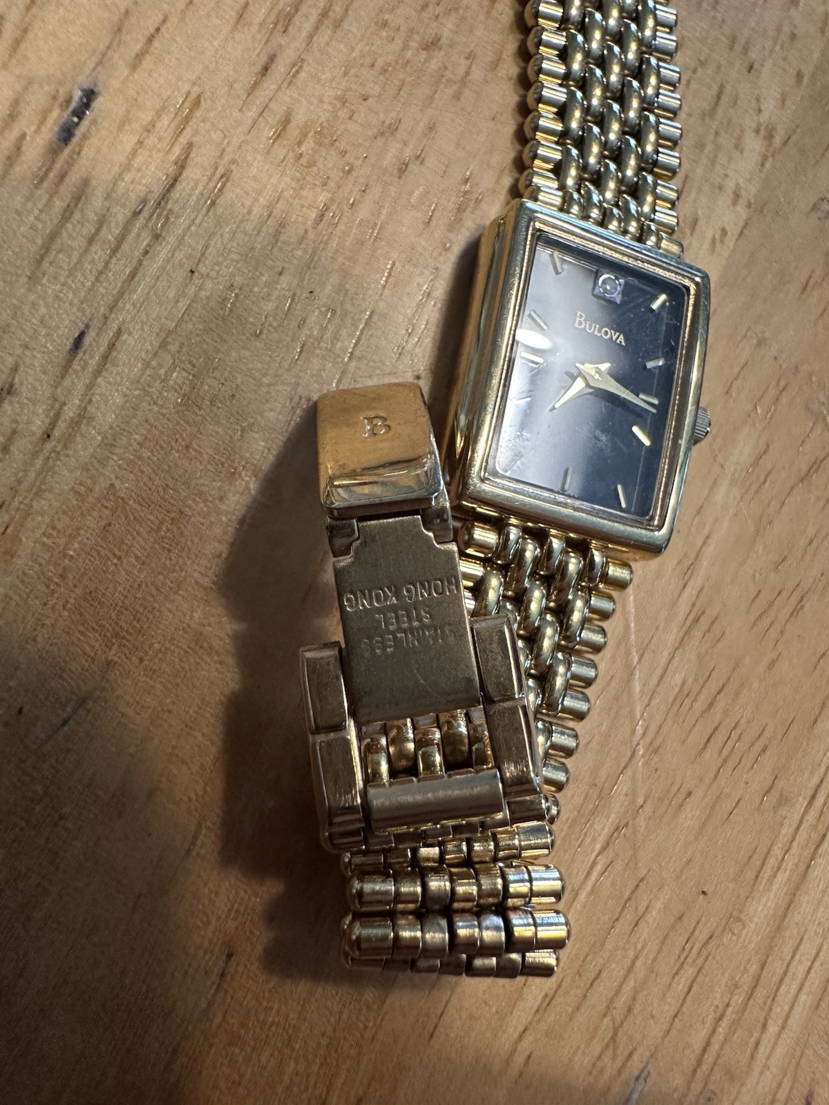 Bulova Quartz T4 Base Metal Bezel Stainless Steel Back Gold Tone With Black Dial