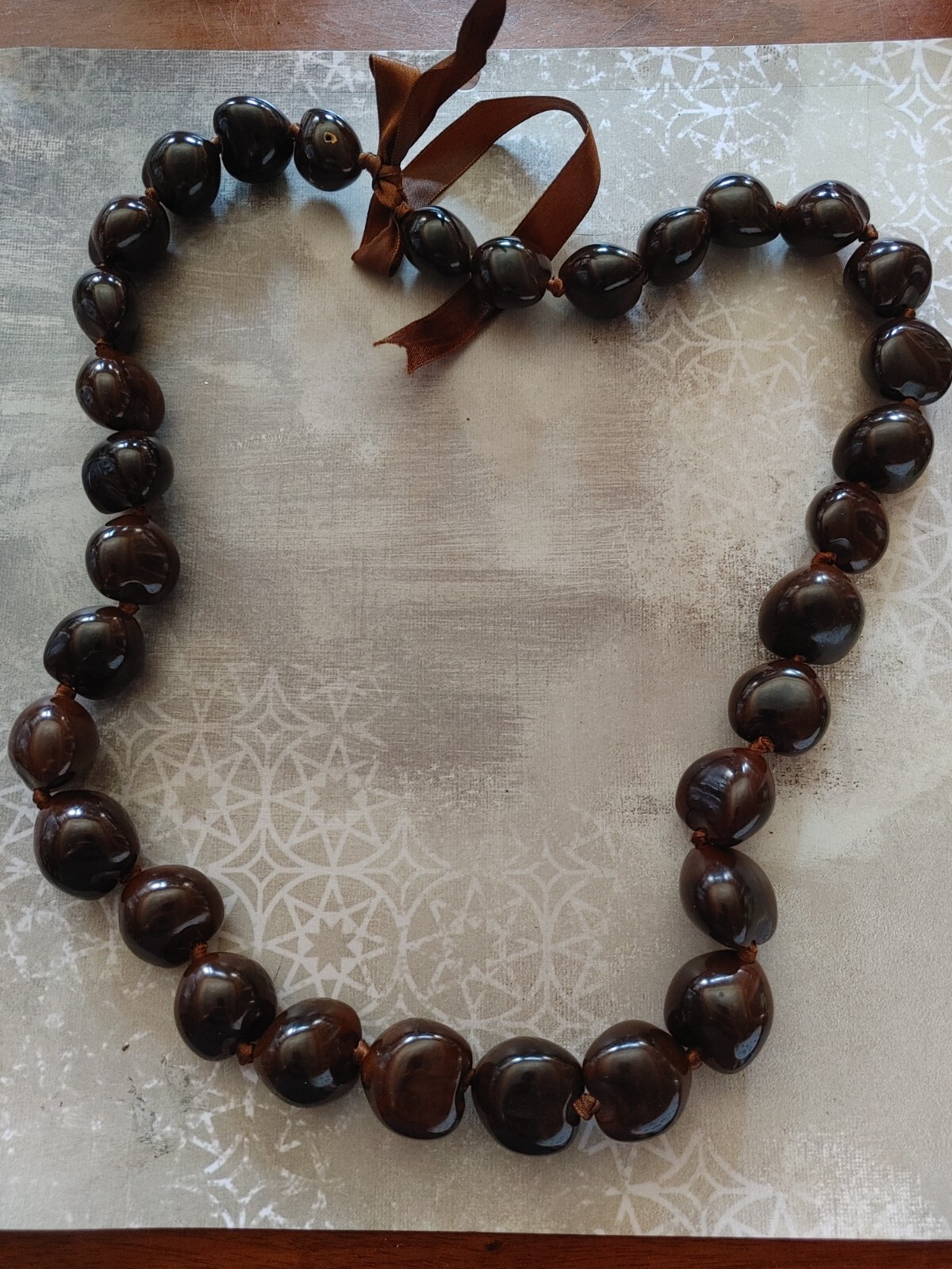 Vintage necklace large dark brown Kukui Nut lei Hawaiiana brown ribbon 32″ long