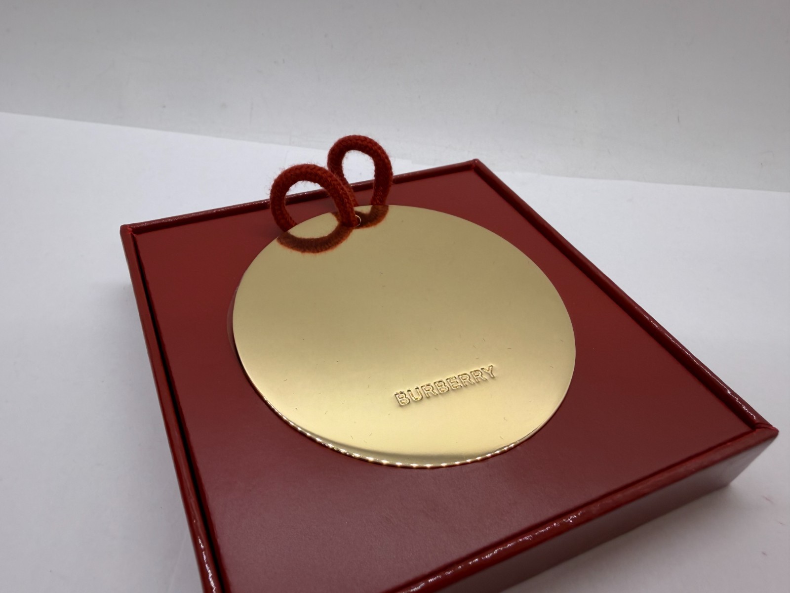 Burberry Metal Gold-Tone Round Brand Engraved Medallion Ornament Bauble