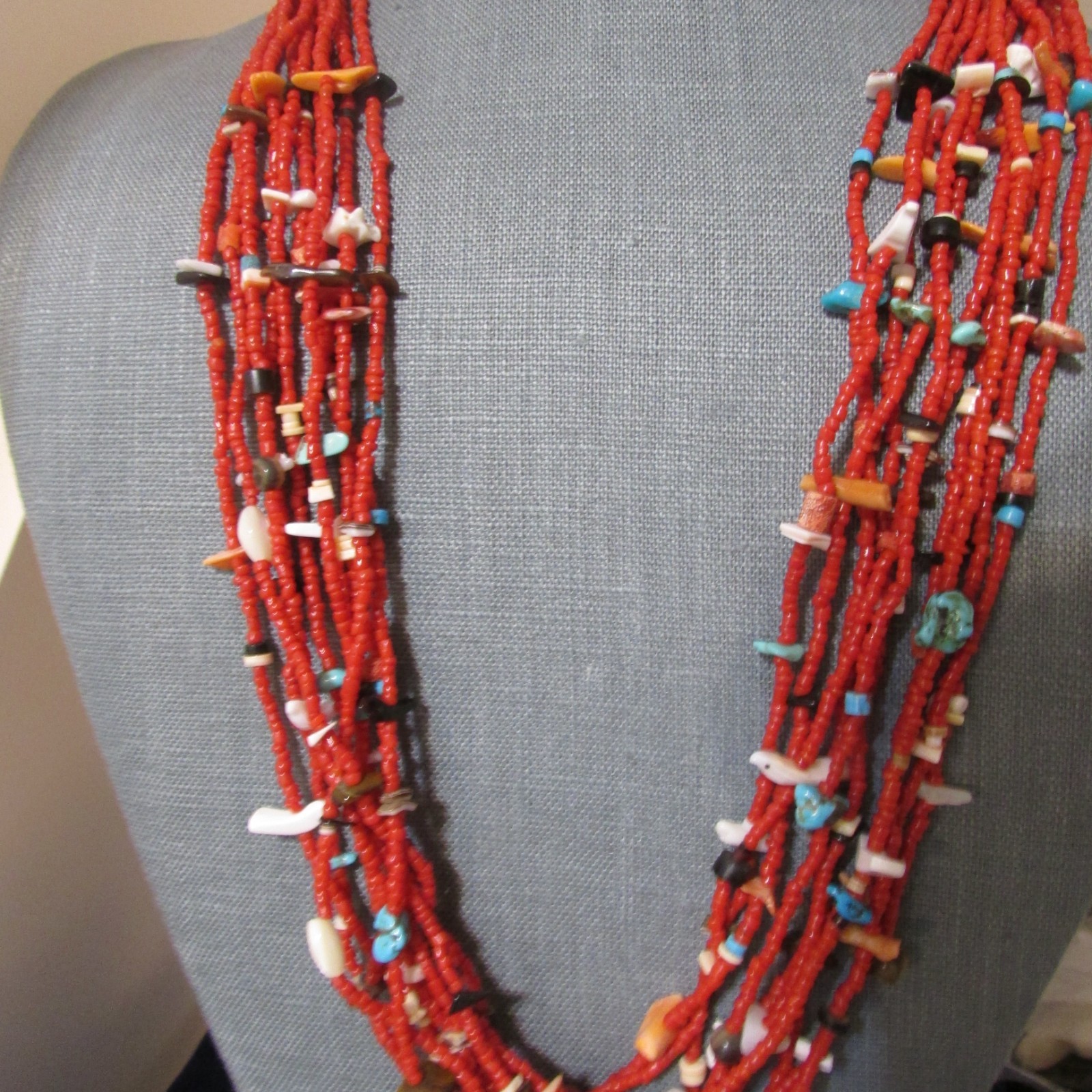 VINTAGE SOUTHWEST N.A, 10 STRAND CORAL NECKLACE, WITH ASSORTED FETISHES