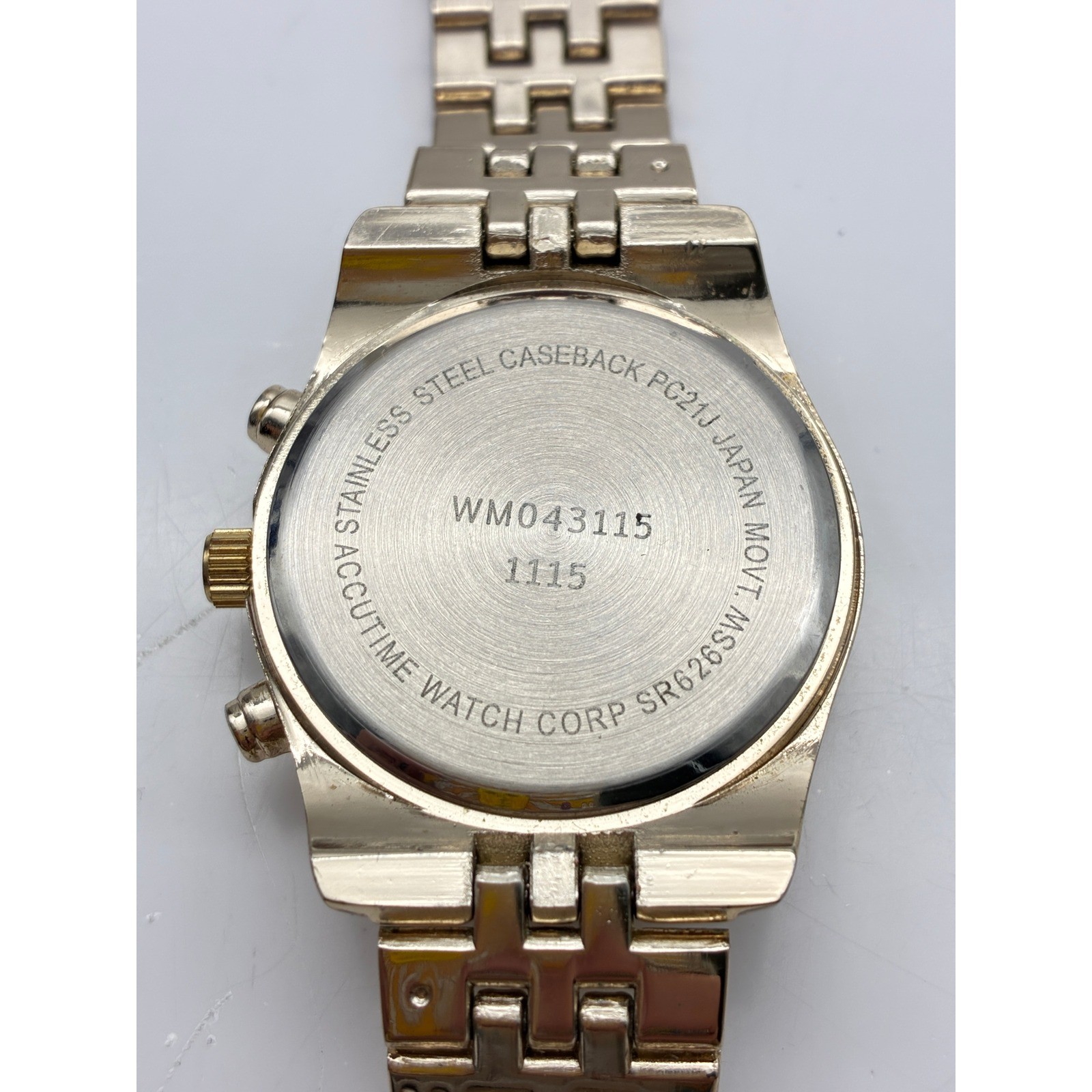 Accutime Watch Corp Gold Tone Blue Dial Chronograph Style Watch WM043115 PC21J