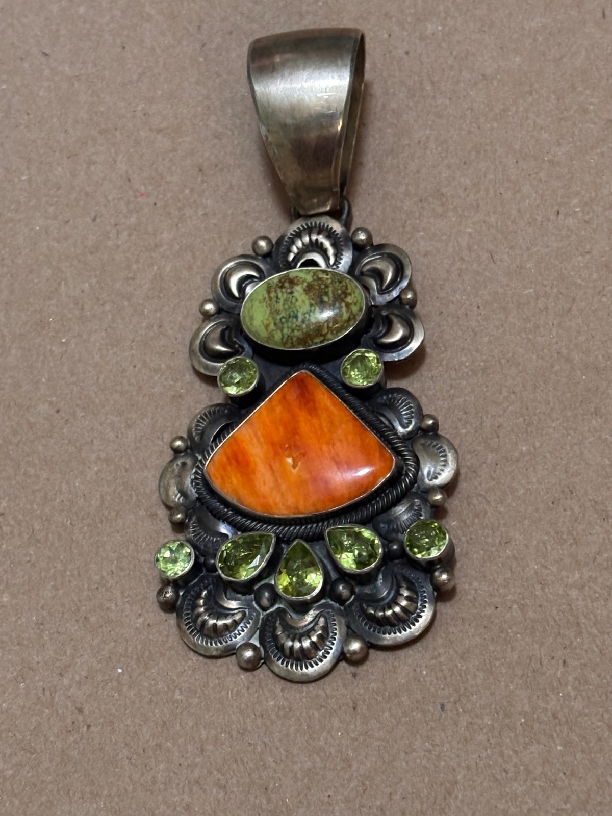 Signed Darrin Livingston Navajo Sterling silver spiny oyster peridot pendant.