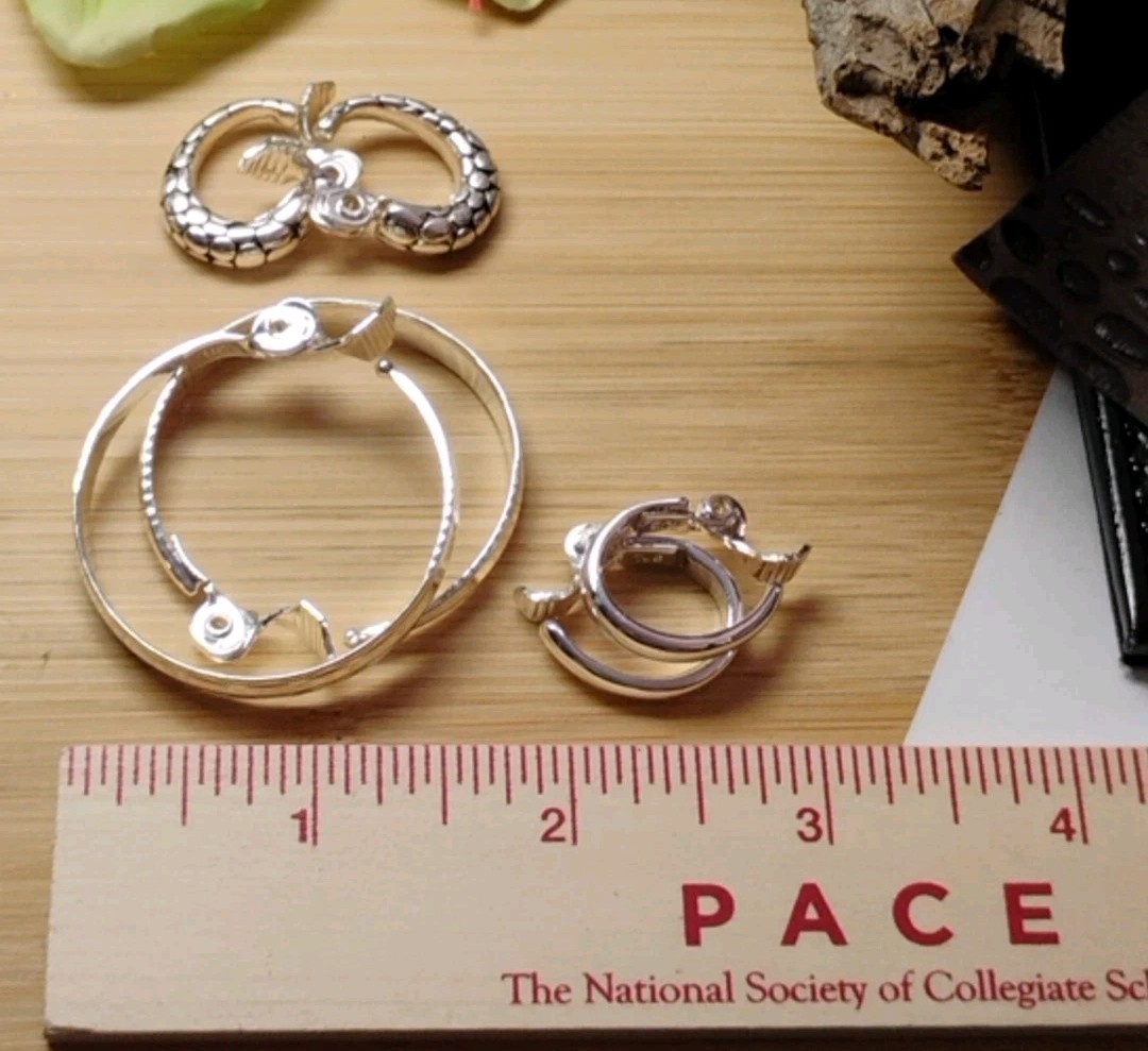 The JEWELRY GROUP TJG Set of THREE (3) Silver Toned Hoop Clip On Earrings!