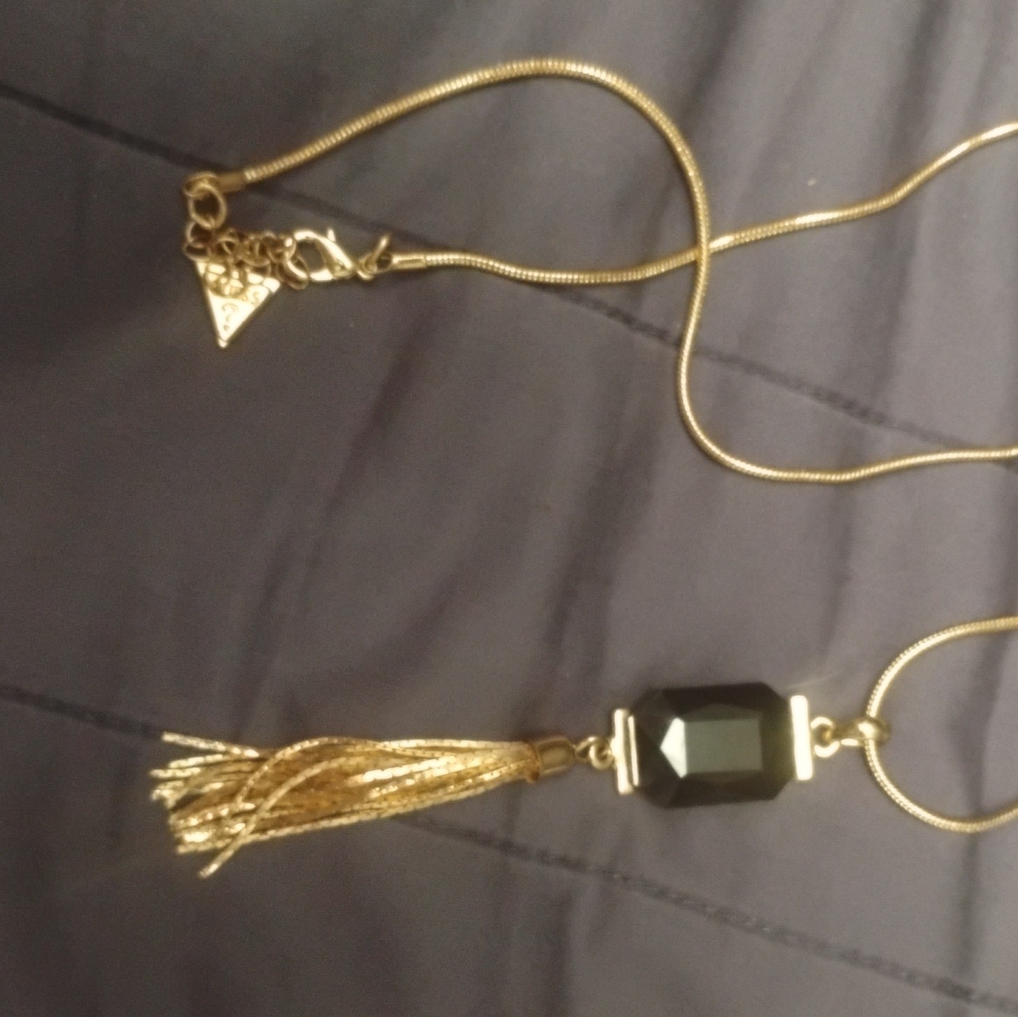 GUESS Gold Tone Snake Chain Necklace, Black Glass Rectangle Tassel Pendant
