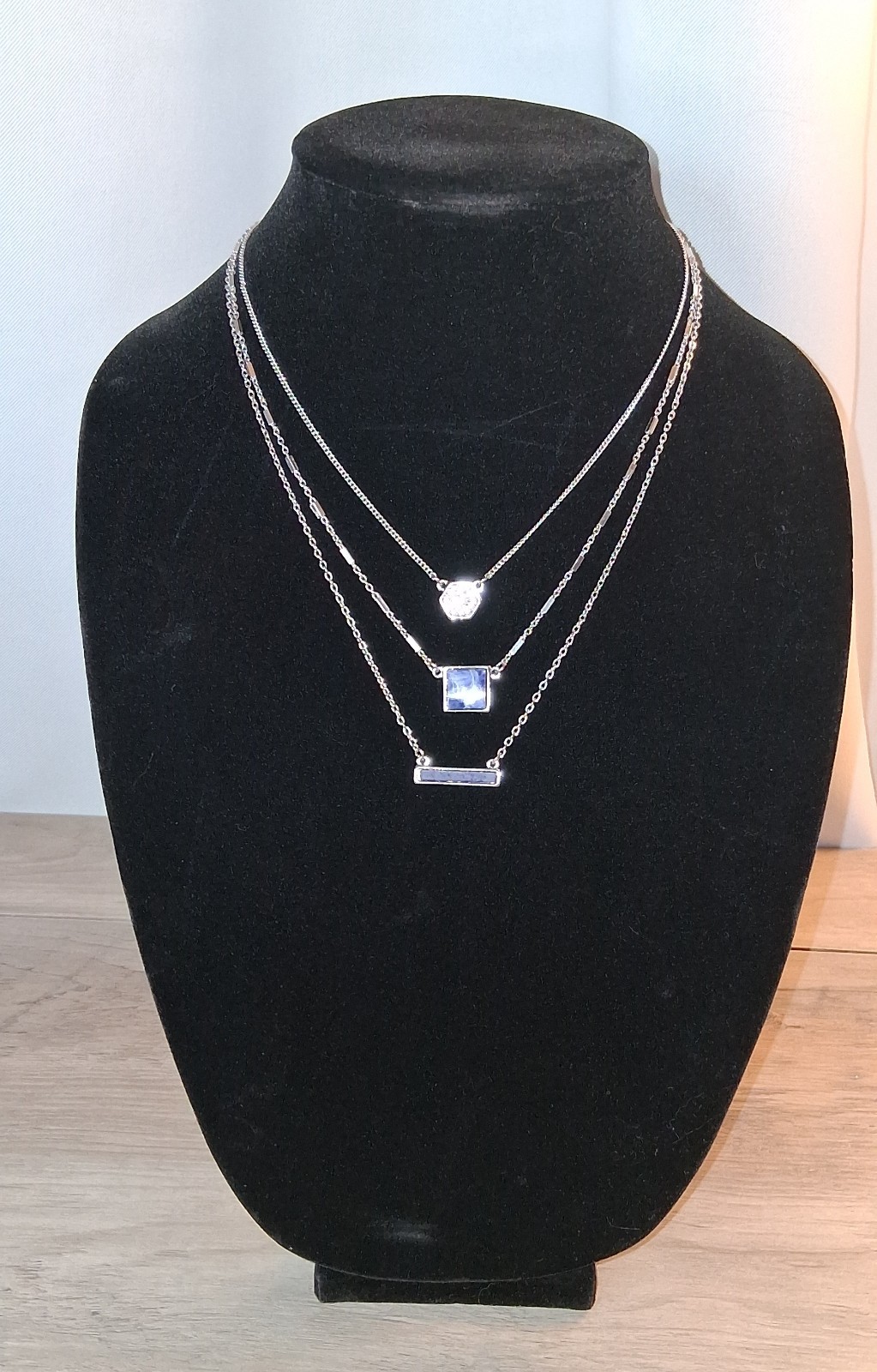 White House Black Market Silver Tone Layered Chain Necklace with Pendants.