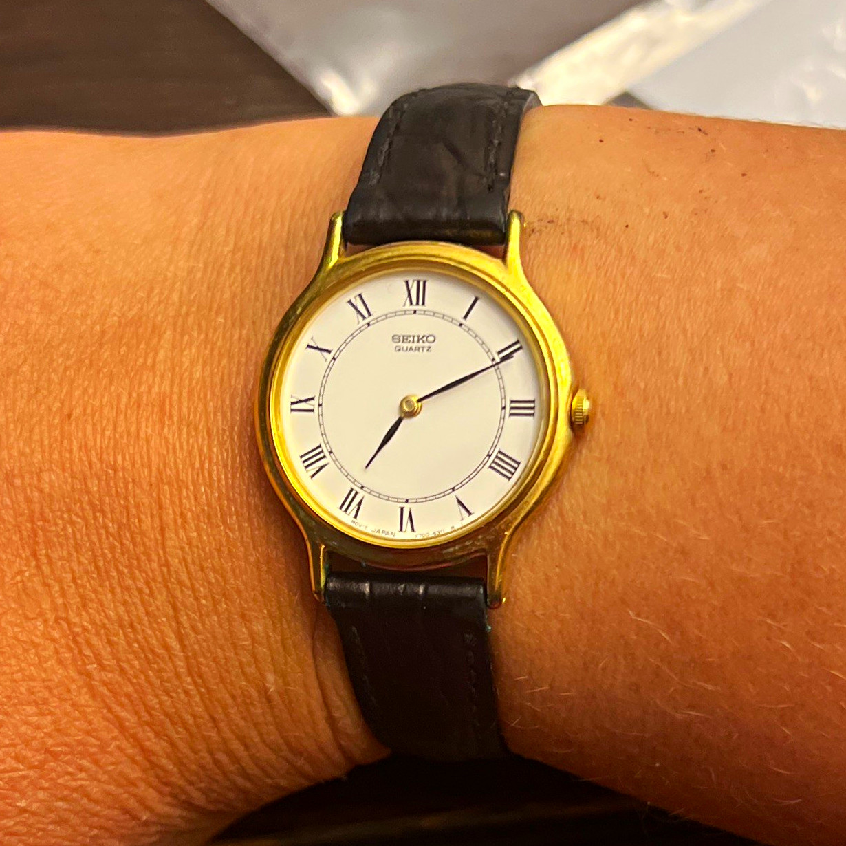 Seiko Women’s Vintage Quartz Gold Tone Case White Roman Dial Black Leather Strap
