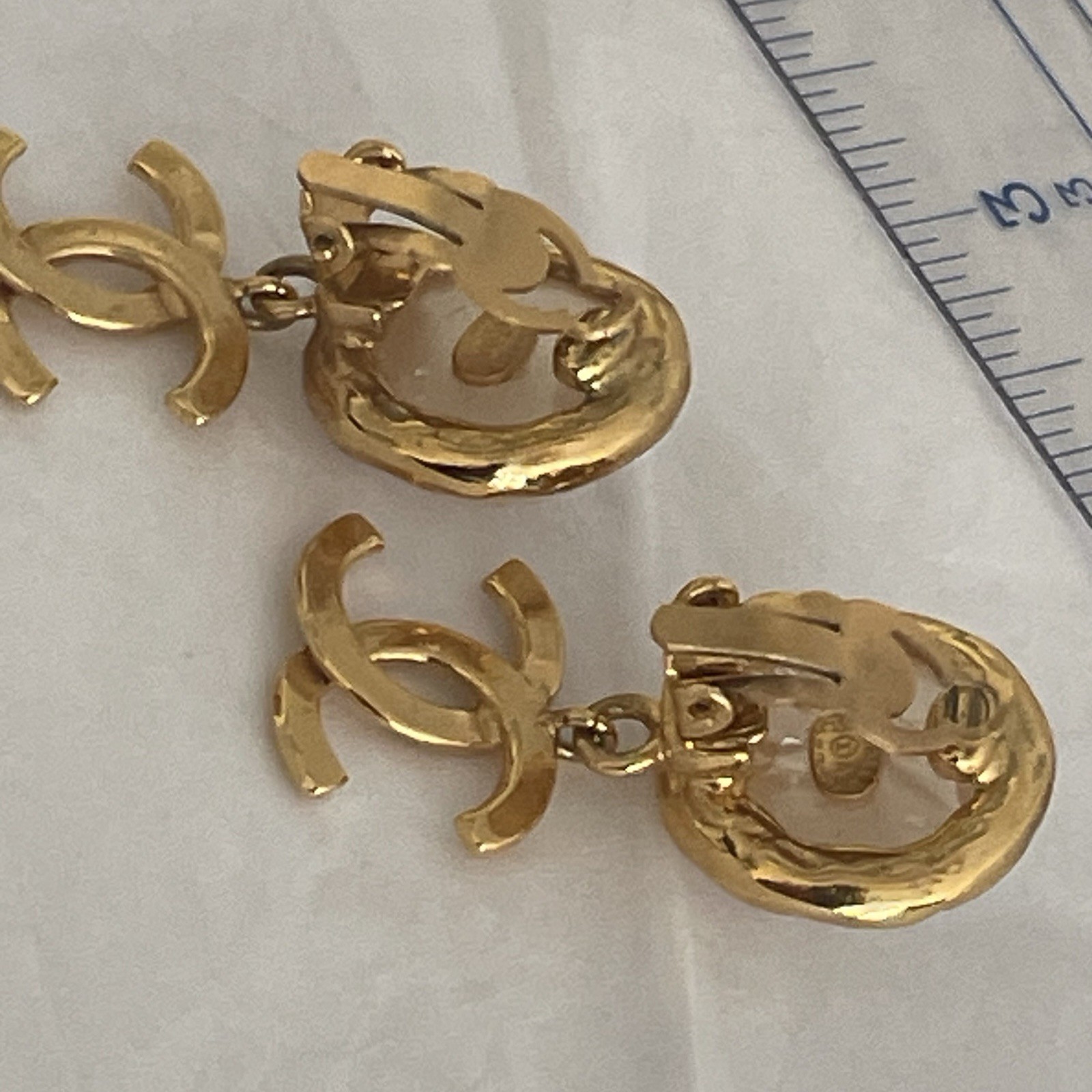 Auth. vtg CHANEL 1995 gold 3D CC logo dangle with round moonlight stone stamped