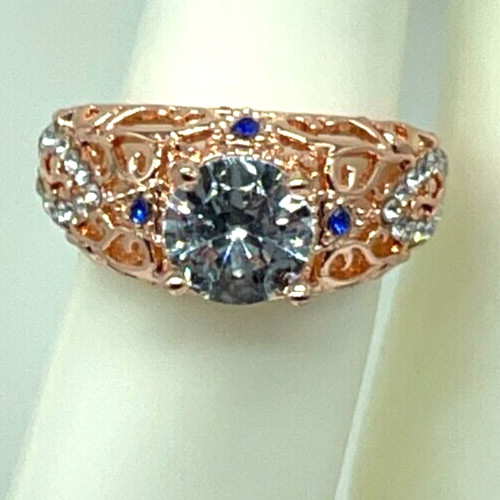 Ring Rose Gold Clear Center Crystal, Clear & Blue small crystal accents. Sz 6