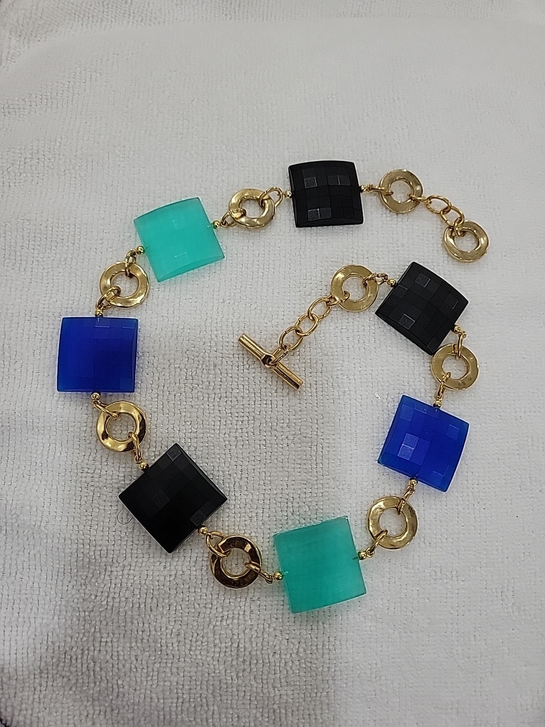 Blue,teal,black Facetted Puffed Square Panels W/ textured Golden Rings Necklace