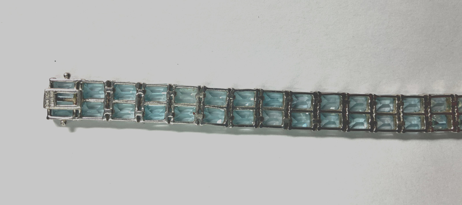 8” TENNIS BRACELET -ADI 925 STERLING SILVER – 40 EMERALD CUT TOPAZ STONES -NICE!