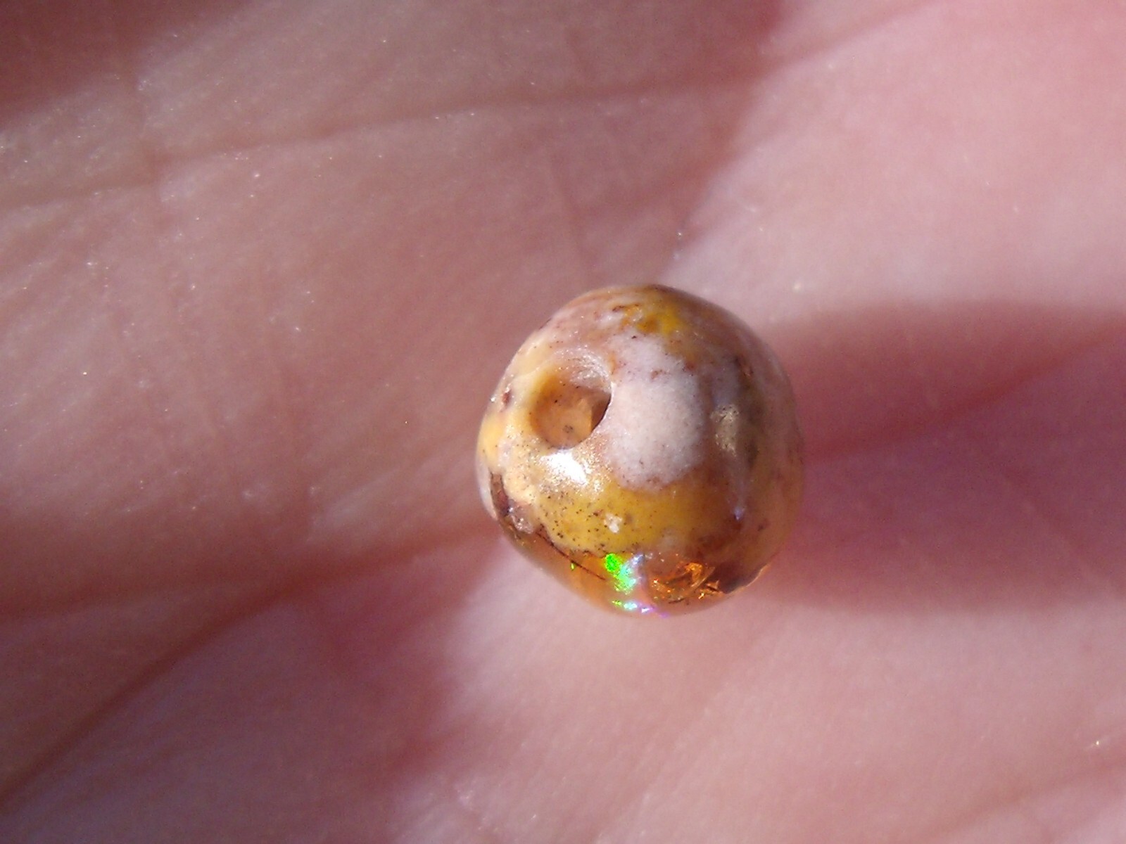0.82 Ct. Round Cut Mexican Cantera fire opal bead.