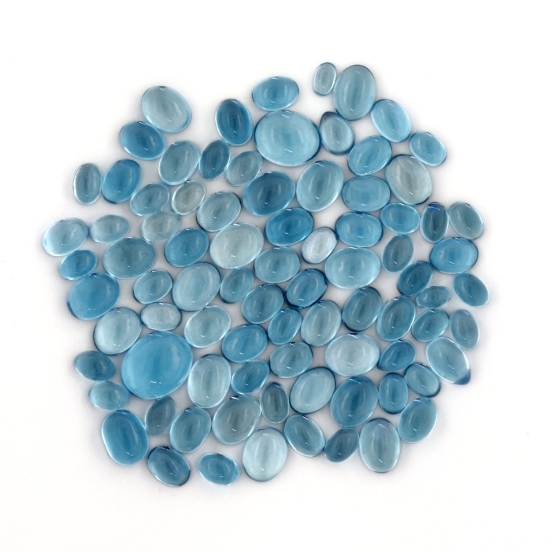 LONDON BLUE TOPAZ 100 CARAT LOT OF APPROX. 7 x 5 MM OVAL CUT CABOCHONS F-5630
