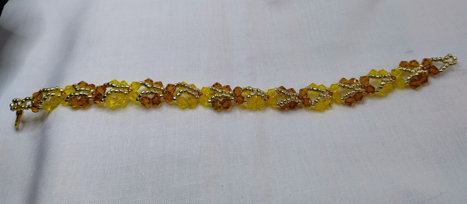 Handmade Beautiful Butterfly design bracelet in Honey, Yellow and Gold Colours