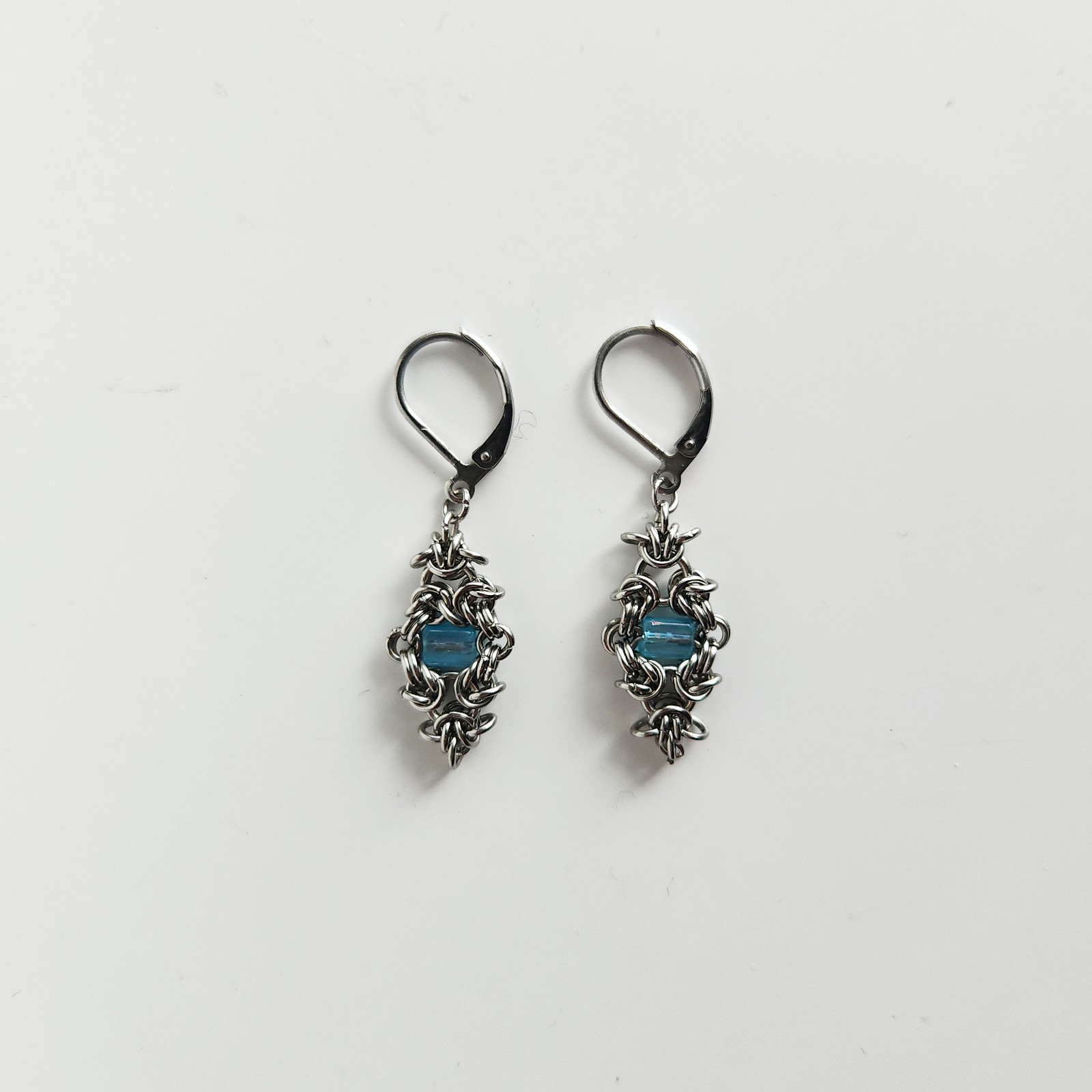 Silver and teal dangly lever back earrings made of stainless steel