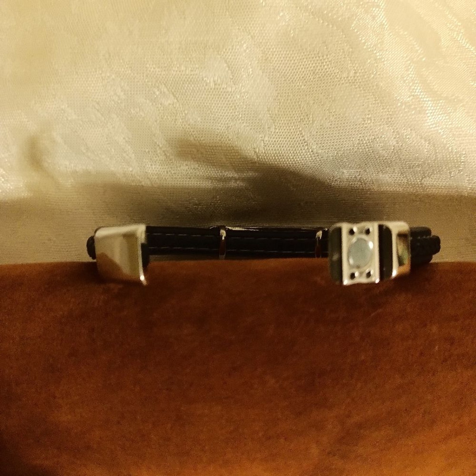 Guess Black leather twine and silver tone women’s bracelet
