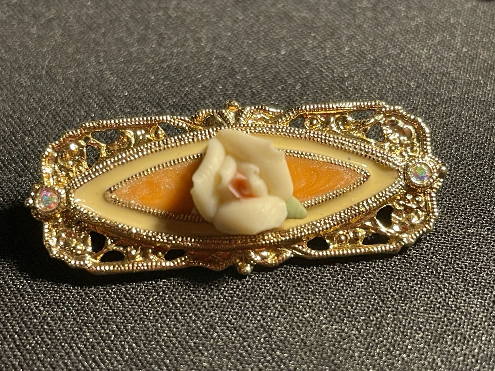 Vintage 1928 Jewelry Company Gold-tone Filigree Bar Brooch with Porcelain Rose