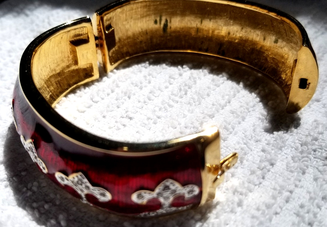 Bejeweled cuff bracelet with Red enamel and Gold tone metal Mint condition