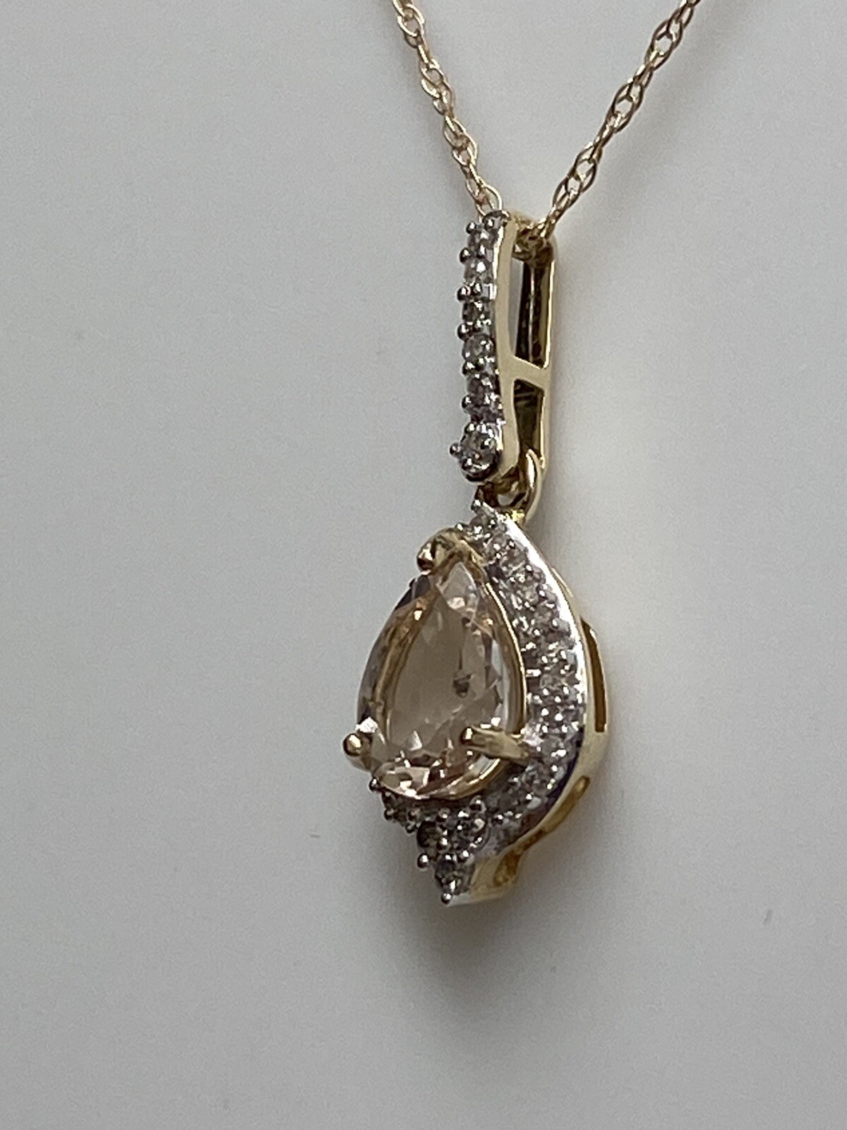 10K Yellow Gold Pear Shape Morganite and 0.11ct twt. Diamond Pendant with Chain