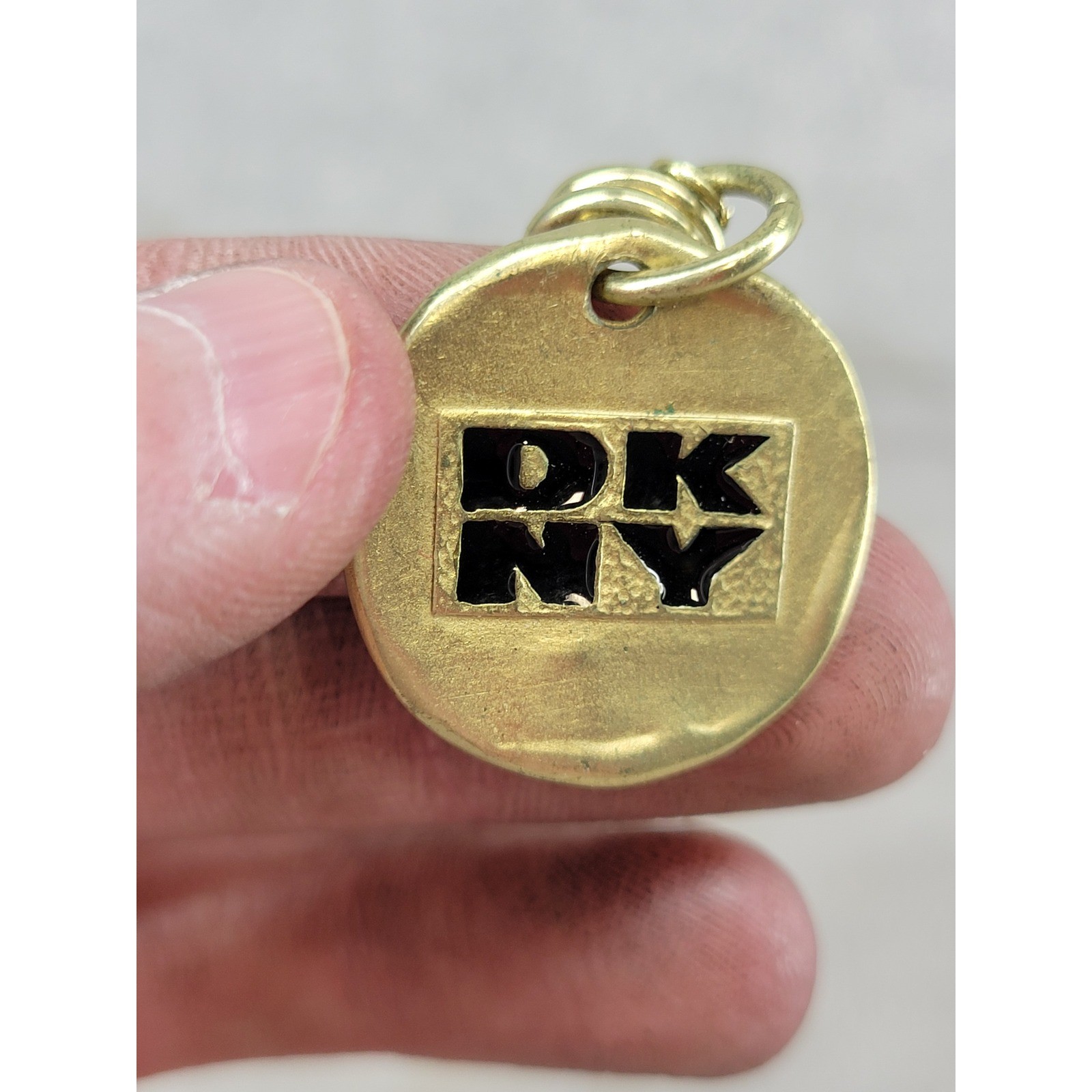 Vintage 1993 DKNY Gold Tone Safety Pin Brooch Round Logo Charm Pendant 3″