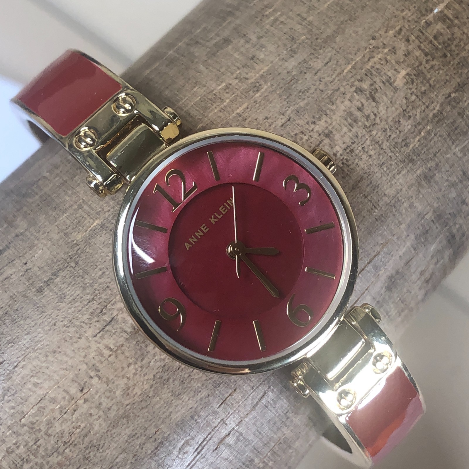 Anne Klein Women AK/2912 Fashion Reddish Pink Dial Gold Tone Quartz Watch 7″