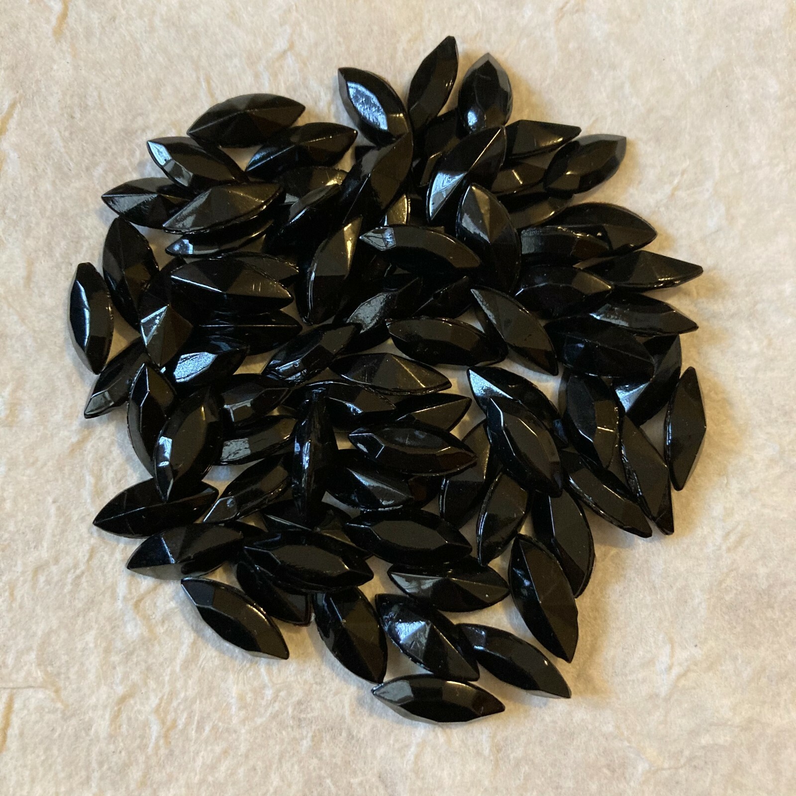 AB10 15x7mm jet black opaque glass navettes,faceted front,pointed back (60)
