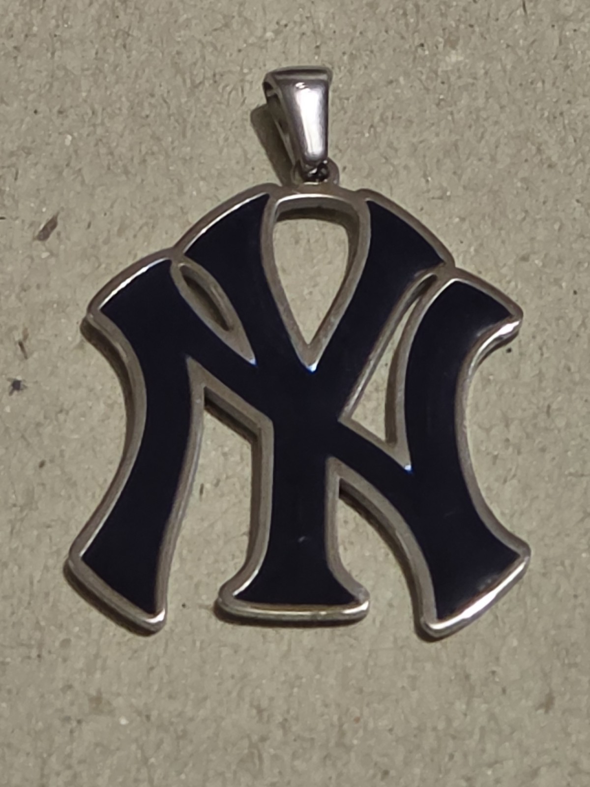 NY YANKEES BLUE NY STAINLESS STEEL CHARM Is 1.5″ High By 1″ Wide