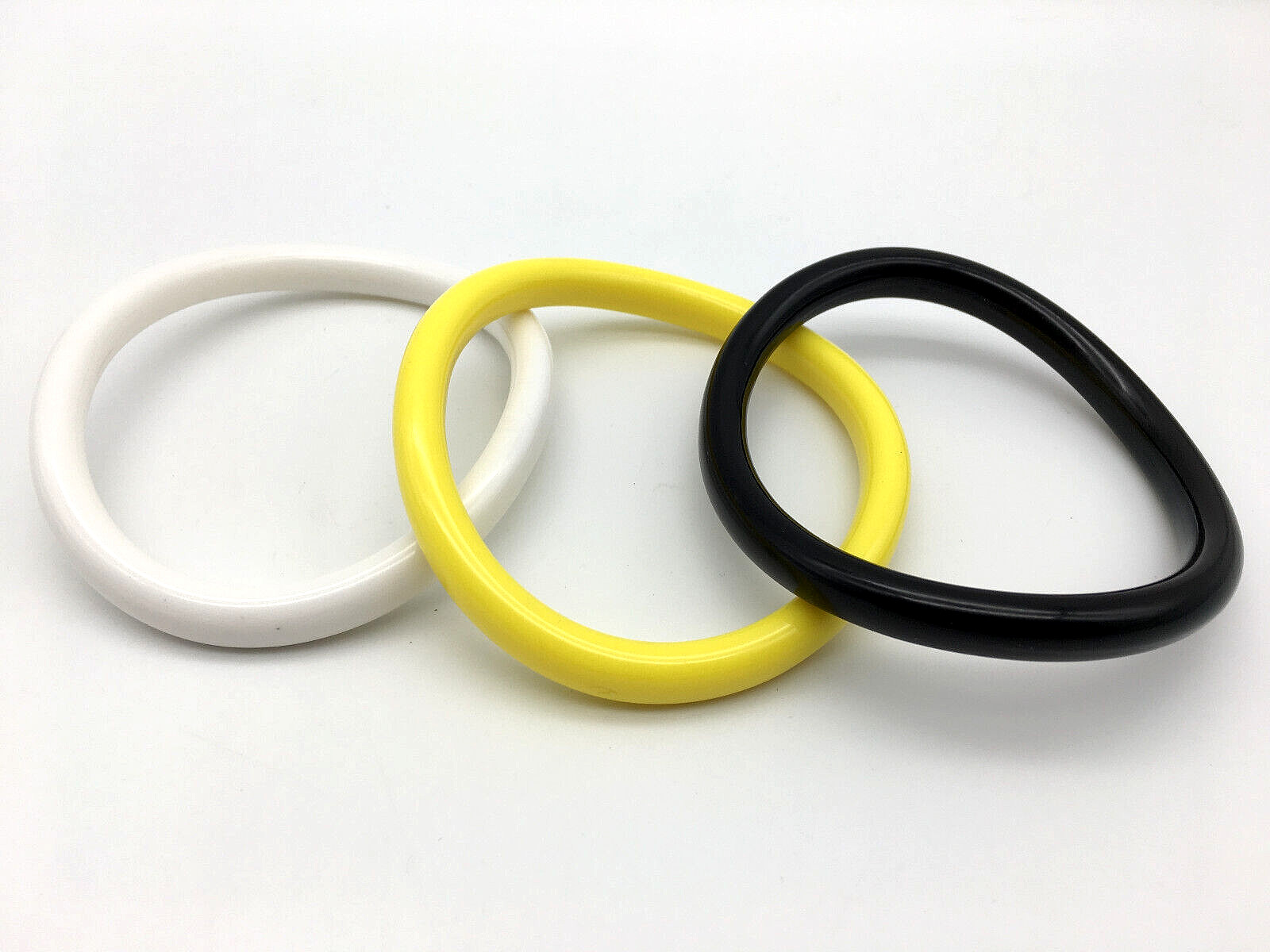 Lot of 3 Bracelets, Yellow, White & Black Lucite Wavy Bangle Bracelets