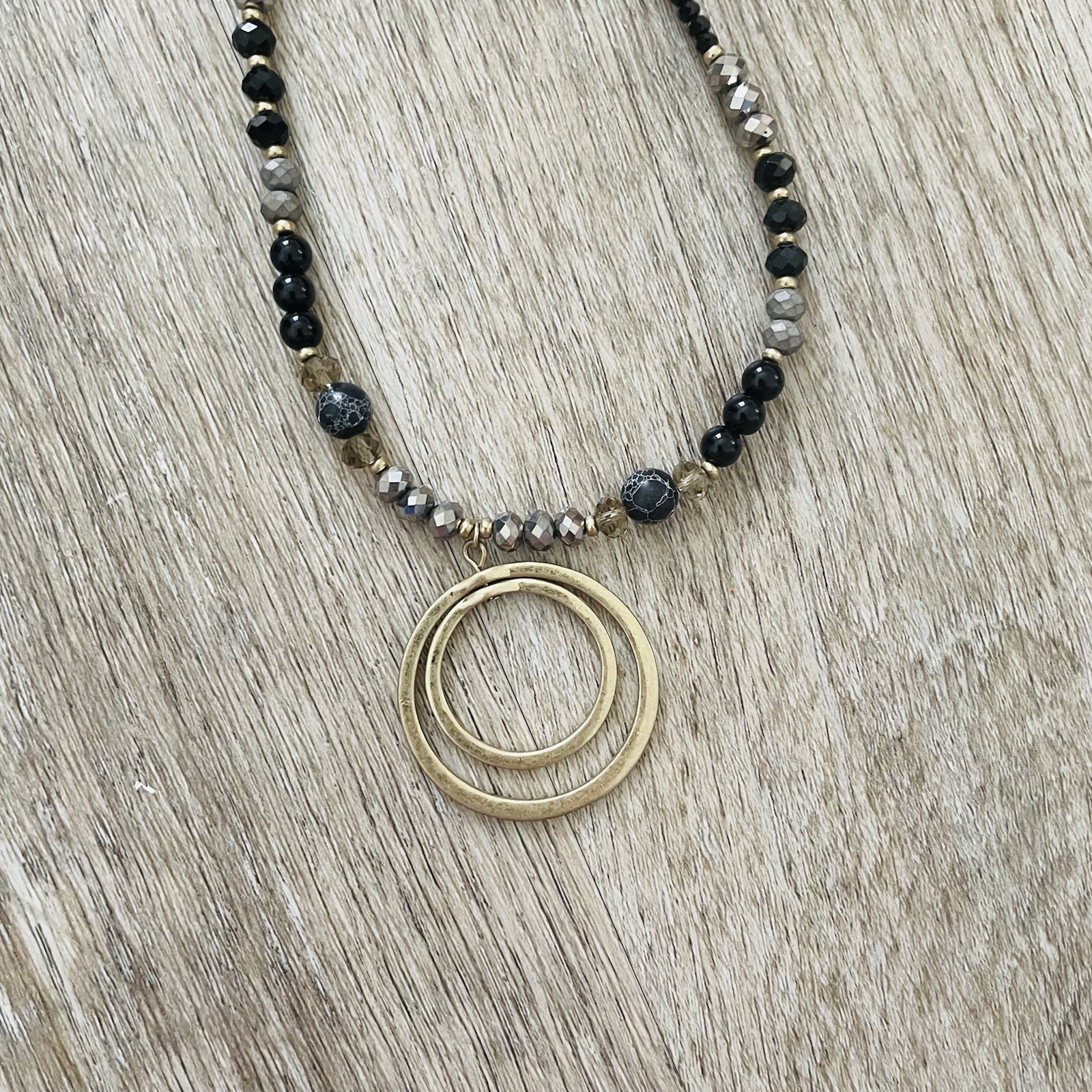 Gold Double Ring Pendant Necklace with Black and Gray Beads