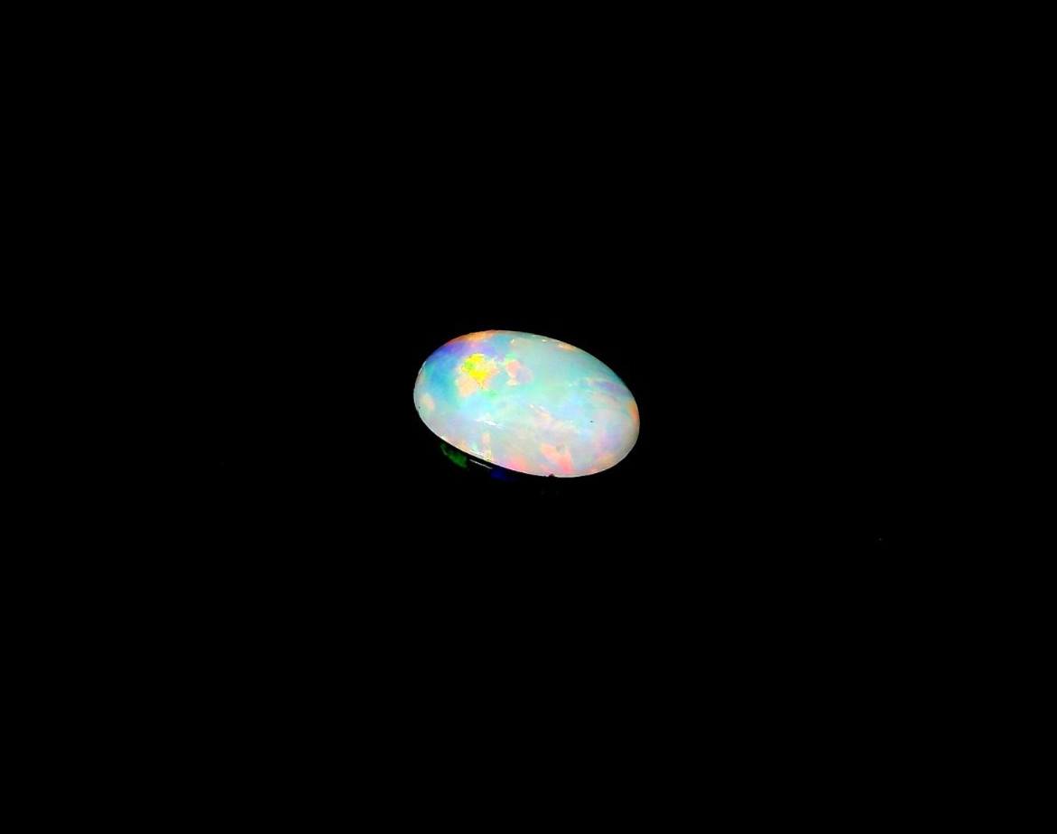 0.36ct Oval Shape White Blue Multi-Color Opal 7 x 5 mm