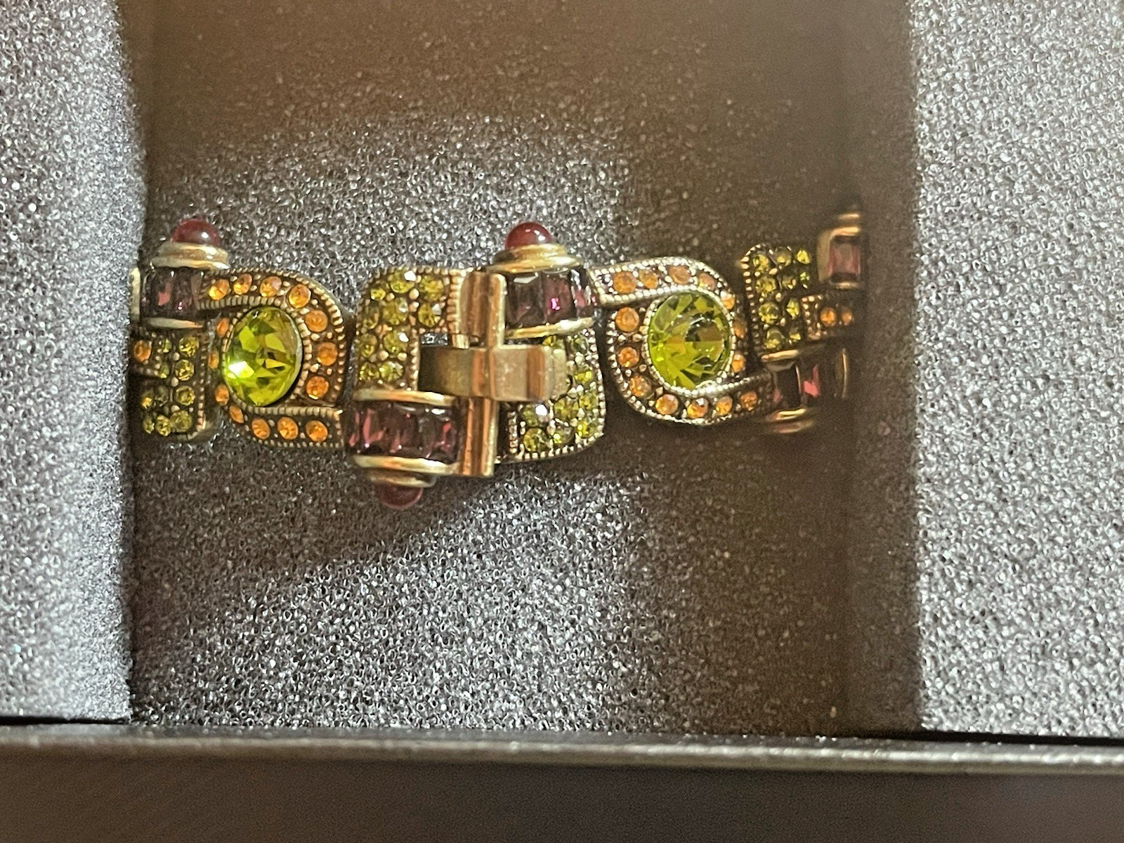New Heidi Daus Bracelet in Original Packing. Olive Green, Red, Yellow Crystals.
