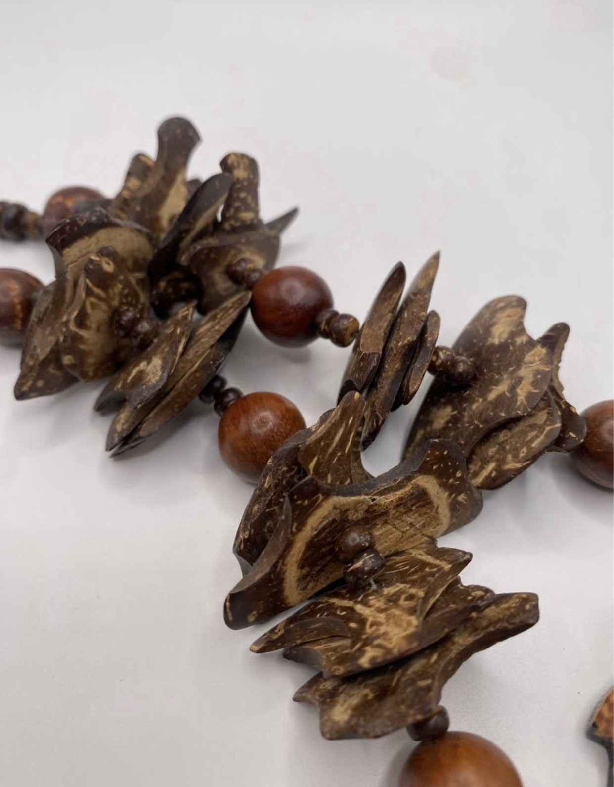 Wood Beaded Necklace by designer Lee Sands . Lion Face Animal Charm Pendant, by