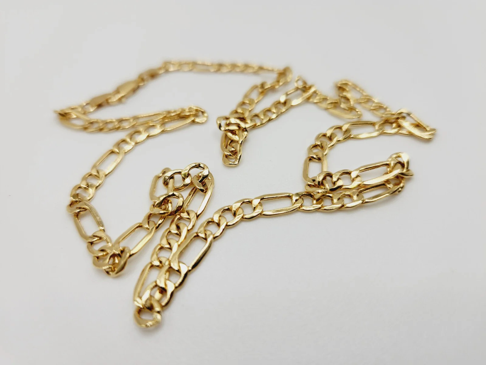 14Kt Yellow Gold Figaro Chain Hollow 18.0 Inches long x 4.40 mm x 1.39mm